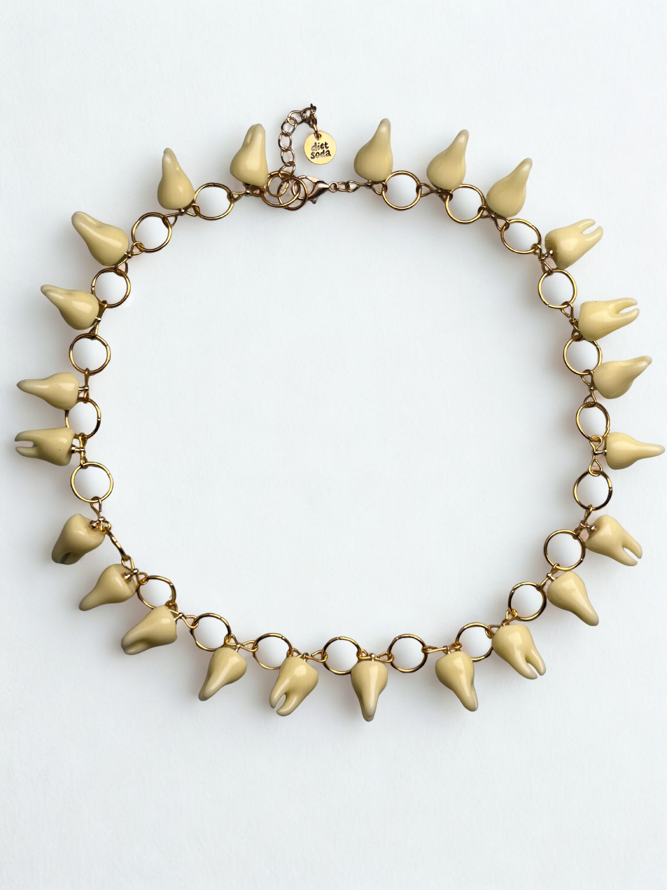 she bites necklace