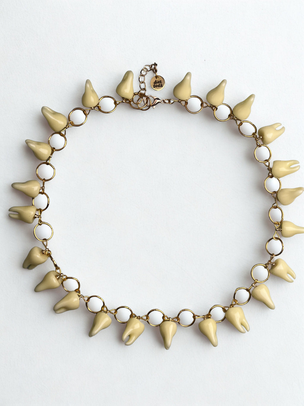 she bites necklace